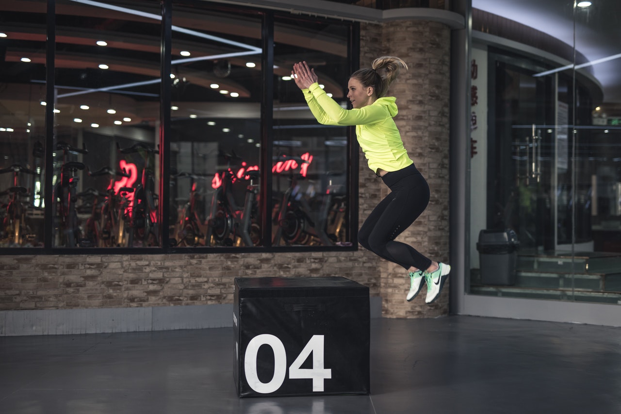 woman in sports apparel jumping