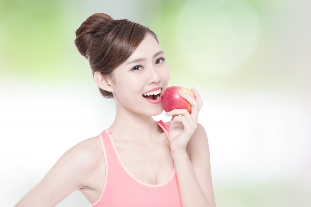 person eating apple