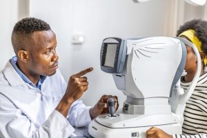 eye doctor using a machine for his patient