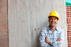 a smiling engineer in construction site